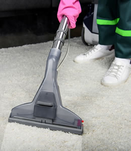 vacuum cleaning a carpet