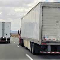 2 semi trucks delivering freight